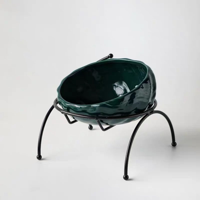 Dark green ceramic pet bowl in elevated black metal stand
